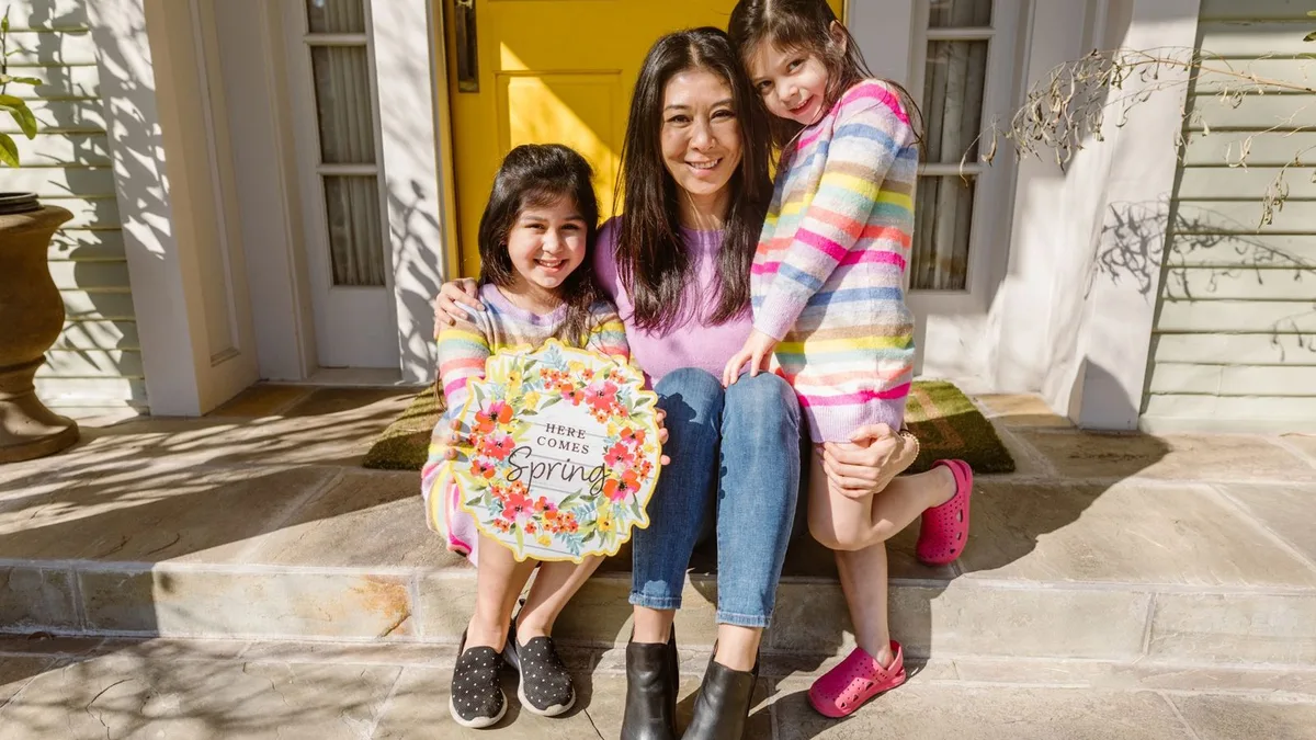 A mother at home with her children, the kind of family goals a VA cash-out refinance can help fund