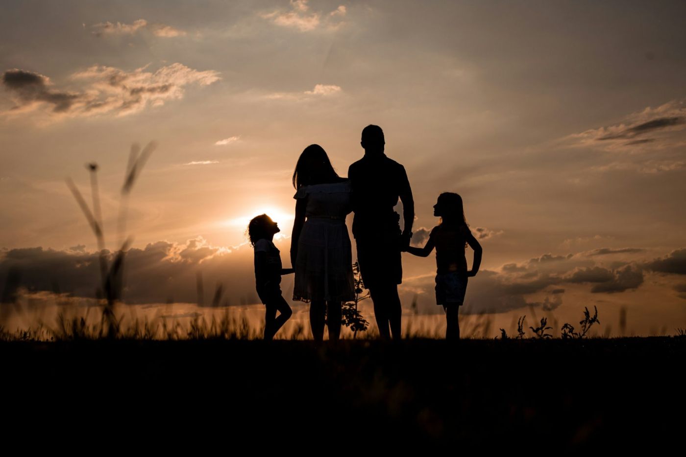 Local Las Vegas family together at golden hour outside their home